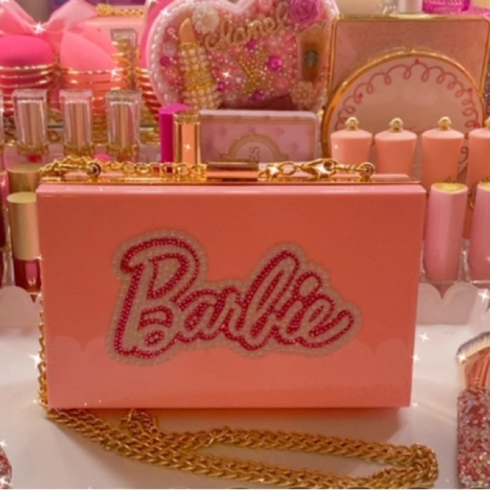 Pink clutch handbag with bling